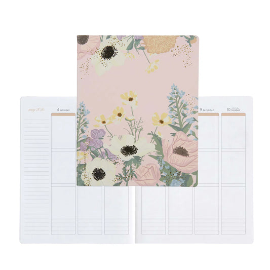 Floral notebook with two pages showing grid layouts on a white background