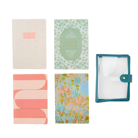 Set of five colorful notebooks with different designs on a white background