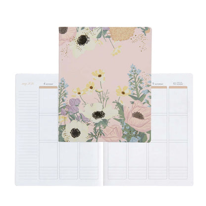 Floral notebook with two pages showing grid layouts on a white background