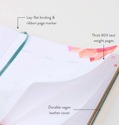 Book with features highlighted: lay-flat binding, ribbon page marker, thick text weight pages, and durable vegan leather cover.