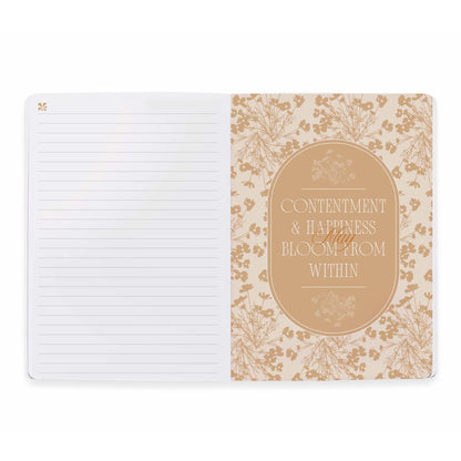 Notebook with floral design and motivational quote on a white background