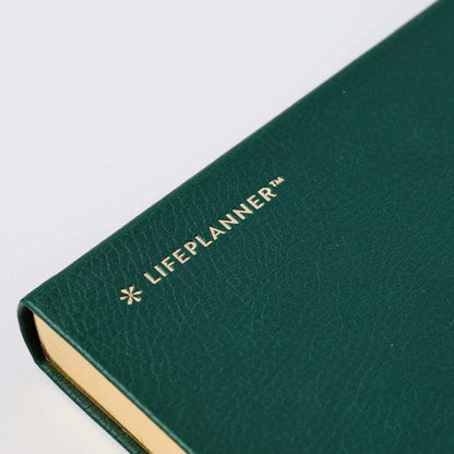 Green planner with 'LIFEPLANNER' branding on a white background