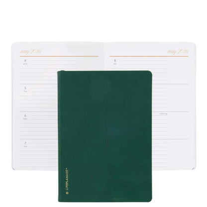 Green planner with a white weekly/monthly layout on a white background